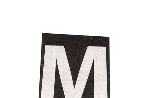 The Letter M Is Made Out Of Black And White Paper