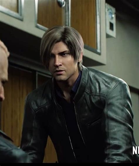 Two Men In Leather Jackets Talking To Each Other