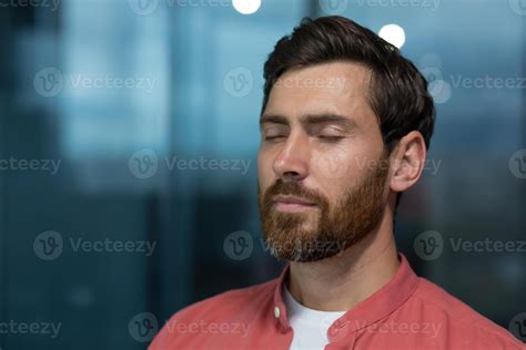 Close Up Of Mature Thinking Businessman Meditating And Thinking With