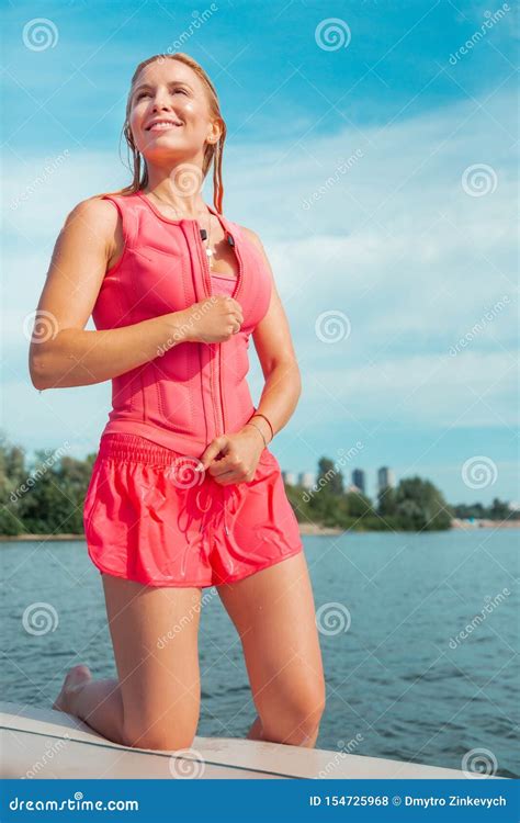 Blonde Pretty Caucasian Woman In Wet Pink Sportswear Stock Photo