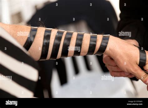 The Hand An Adult Caucasian Man Is Being Wrapped In Leather Strap Part