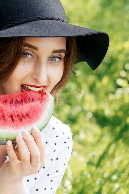 Premium Photo Woman Eating Slice Of Watermelon