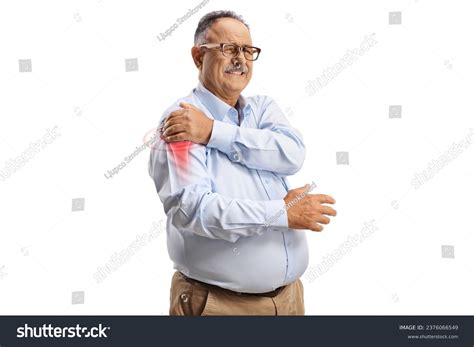 Mature Man Suffering Arthritis Shoulder Joint Stock Photo