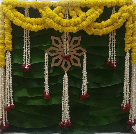 This cute backdrop for Puja is so simple nd elegant💛💚 #pujadecor # ...