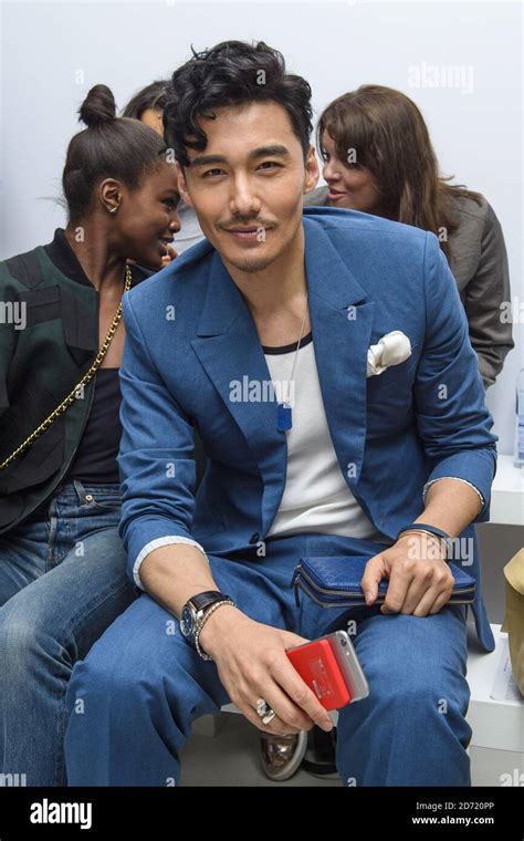 Hu Bing On The Front Row At The Christopher Raeburn Fashion Show Held