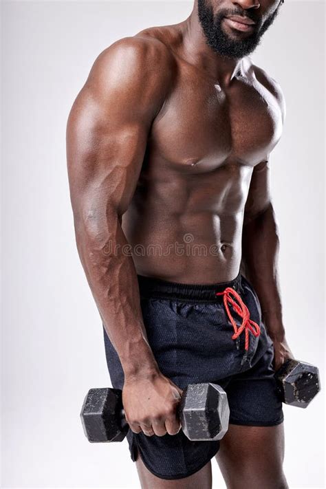 Cropped Muscular African Man With Naked Torso Holding Dumbbells In Hands Exercising Stock Image