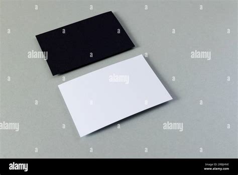 White And Black Business Cards With Copy Space On Grey Background Stock