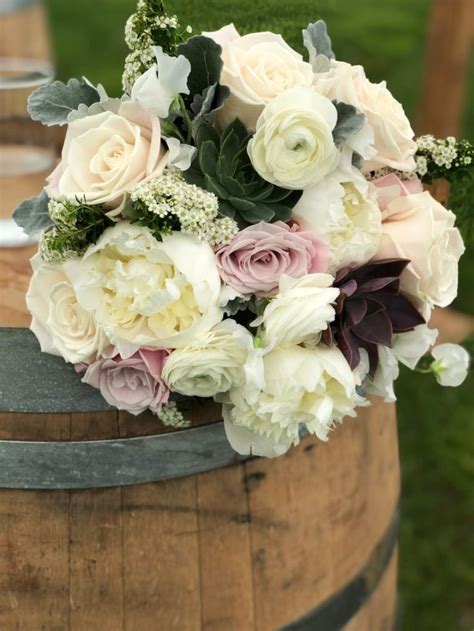 Peony And Succulent Bouquet With Roses Ranunculus And Bridal Veil