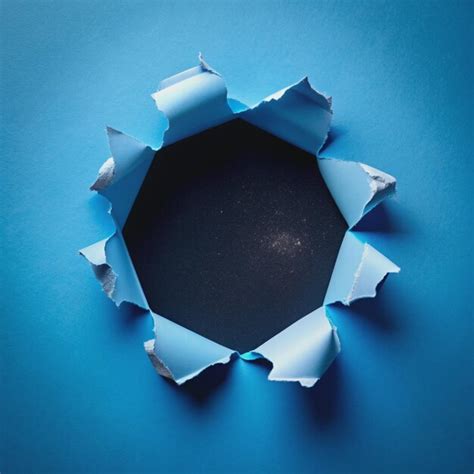 Torn Paper Revealing A Black Background With Stars Premium Ai