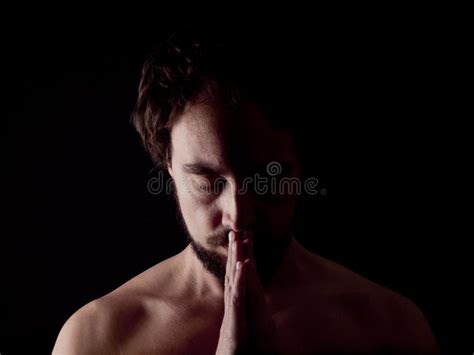 Low Key Image Of A Praying Bearded Man Stock Photo Image Of Focused