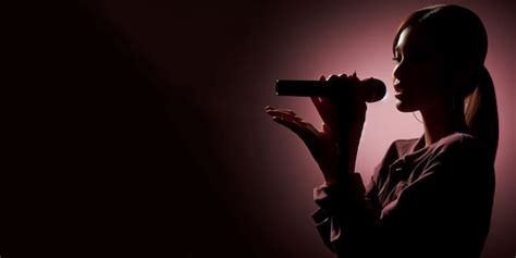 Premium Photo Female Singer Holding Microphone Singing In Pink Dark