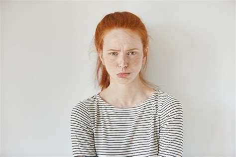 Free Photo Pretty Girl With Ginger Hair Gathered In Ponytail Pouting