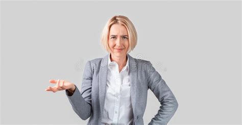 Puzzled Mature Lady Boss Asking For Explanation On Light Background