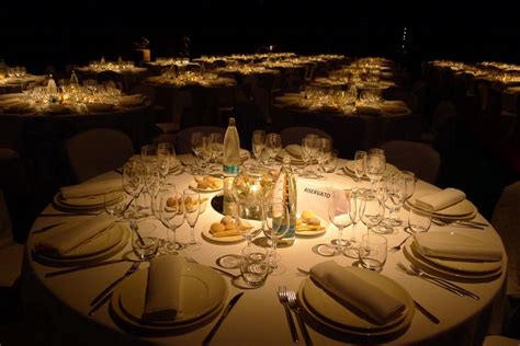 The Table Is Set With Silverware And Wine Glasses For An Elegant Dinner