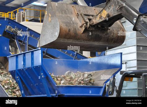 Excavator Loading Trash In A Waste Recycling Plant Is Sorting Waste