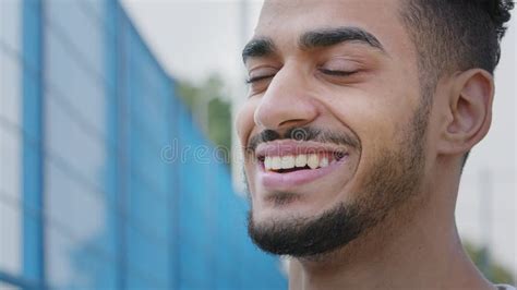 Happy Smiling Young Man Looking Aside Rejoicing At Meeting Raising Eyebrow Feeling Delight