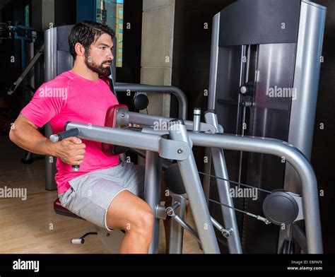 Seated Back Row Machine Man Workout Exercise At Gym Stock Photo Alamy