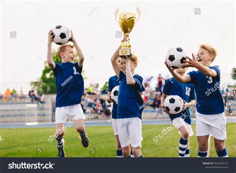 Boy Playing Soccer Holding Trophy Images Stock Photos Vectors