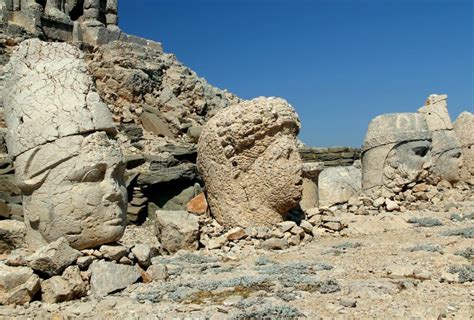 Photo With The View Of Huge Stone Heads Of Statues Of Greek Gods On