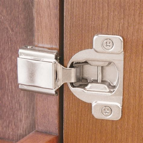 A Close Up Of A Wooden Door With A Metal Latch On The Front And Side