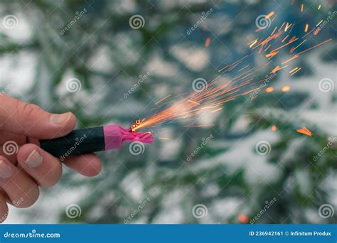 Burning Firecracker In A Hand Sparks And Smoke Of Petard Stock Image