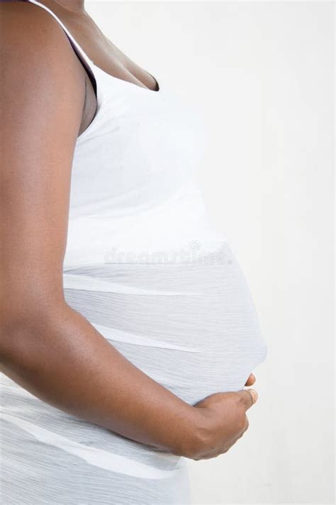 Beautiful Pregnant African American Woman Touching Her Belly B Stock