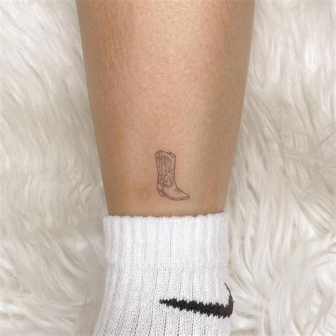 Fine Line Cowboy Boots Tattoo Located On The Shin