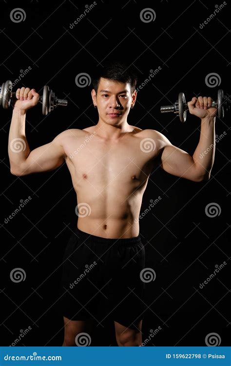 Athletic Muscular Bodybuilder Man With Naked Torso Six Pack Abs Working