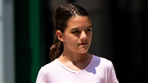 suri cruise     parents footsteps