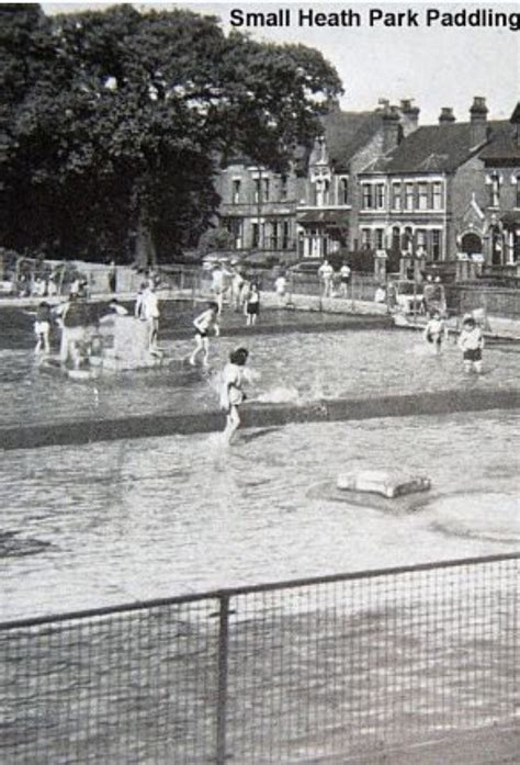 an old black and white photo of people playing in the water