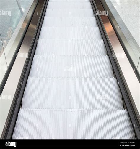 Escalator in an airport Stock Photo - Alamy