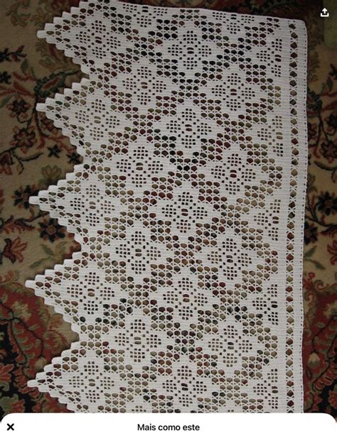 A White Crocheted Doily On Top Of A Rug