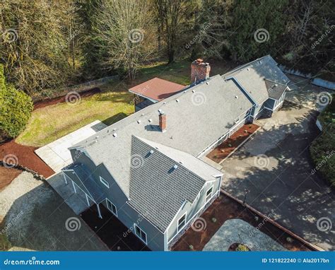 Aerial View Of Large Grey Home Surrounded By Trees Stock Photo Image