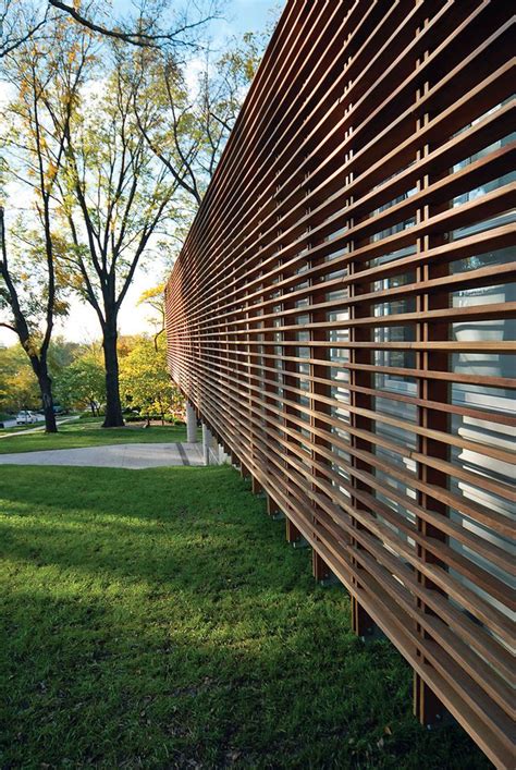 Contemporary Kansas Home With Wood Slatted Exterior Screen Wood