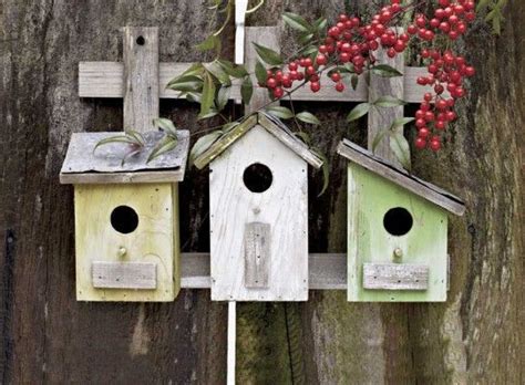 Three Birdhouses on an Old Fence