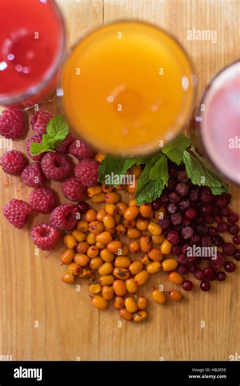 Fruit Drink With Cranberries Raspberries And Sea Buckthorn Stock Photo