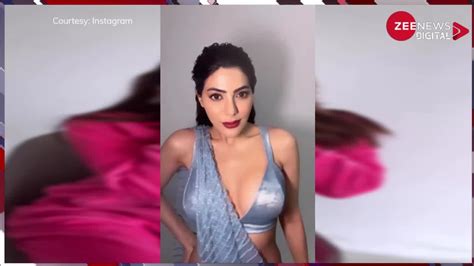 Nikki Tamboli Sizzling Look In Silver Saree With Deep Neck Blouse Watch