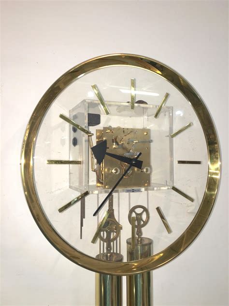 Arthur Umanoff For Howard Miller Brass And Lucite Wall Clock At Stdibs