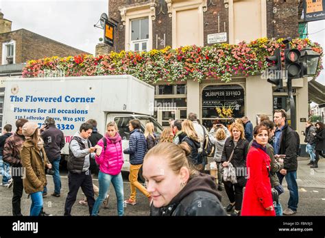 Visitors Of Portobello Street Market In Front Of The Pub The Castle