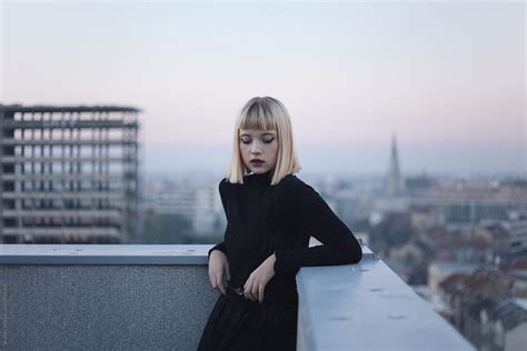 Portrait Of A Beautiful Blonde Woman On The Roof Of The Building During Sunset By Stocksy