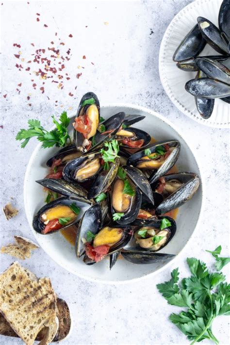 Steamed Mussels With White Wine Garlic And Tomato Broth Pina Bresciani