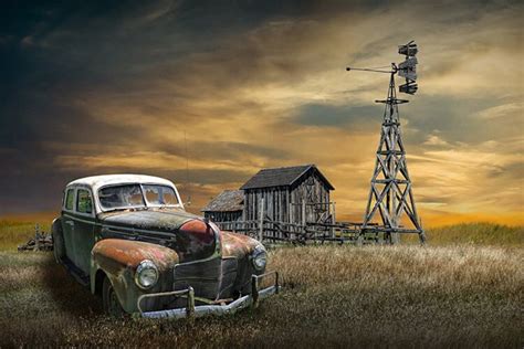 Vintage Auto With Rustic Barn And Farm Windmill Photo Old Automobile On Prairie Farm With