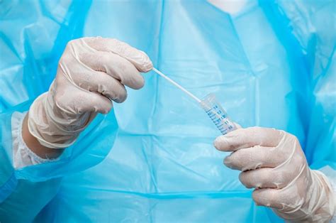 Premium Photo A Medical Worker Holding A Swab Sample Collection Kit