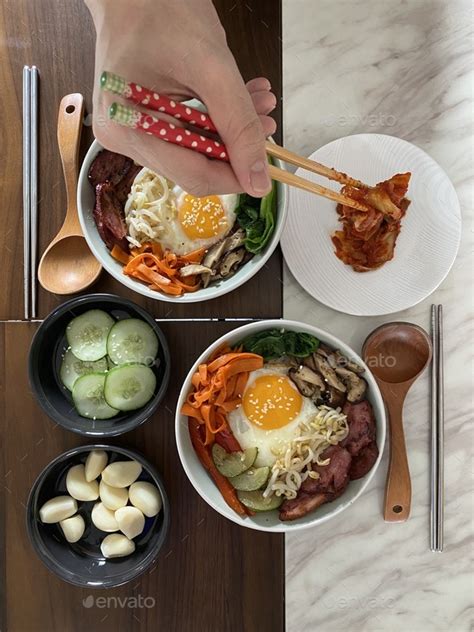 Korean cuisine bibimbap and homemade kimchi Stock Photo by weewendy