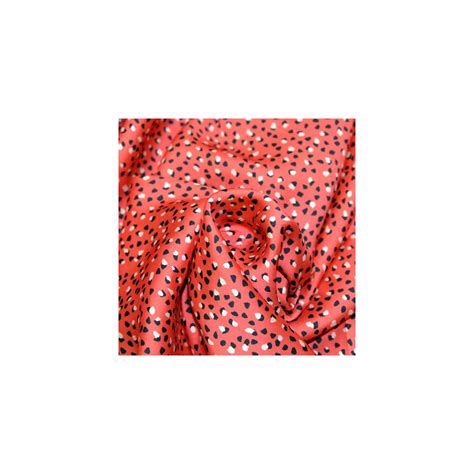 Tissu Satin Polyester imprimé confettis sur fond rouge