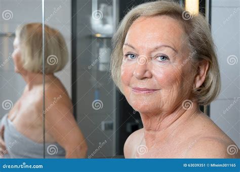 Attractive Blond Senior Woman In A Bathroom Stock Image Image Of Mother Face 63039351