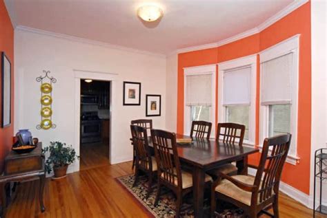 Dining Room with Orange Accent Wall | Angie's List