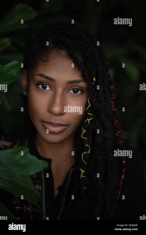 Intimate Close Up Portrait Of Attractive Afro Latina Woman Surrounded