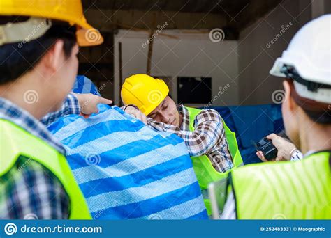 Engineer Holding A Radio To Report The Work Of A Construction Worker