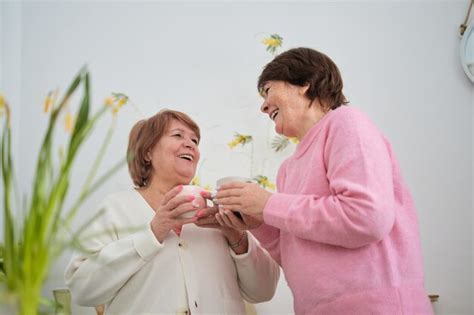 Premium Photo Mature Companionship Two Cheerful Senior Women Celebrating Their Friendship With